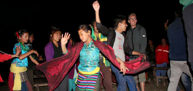© Provided by Forbes Nepalese youth dance with American volunteers