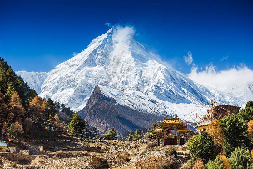 View of magnificent Mount Manaslu ; trekking with a guide
