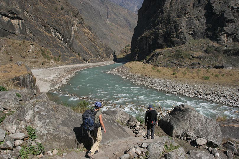 Trekking along with the guide in Manaslu circuit