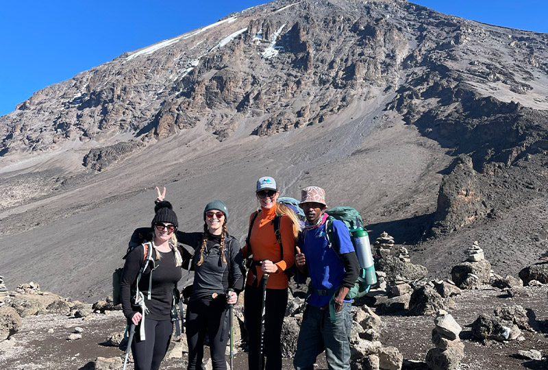 Jessica and her friends hiking to the top of Mount Kilimanjaro; rekindling relationships is one of the emotional benefits of travel